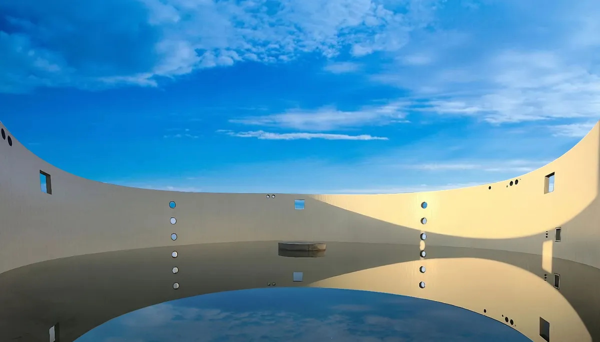 A close-up of a construction site showing the installation of Advantage Formwork panels to create tall, straight concrete pillars and walls, with reinforcing rebar visible within the forms.